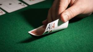 a person holding a casino card