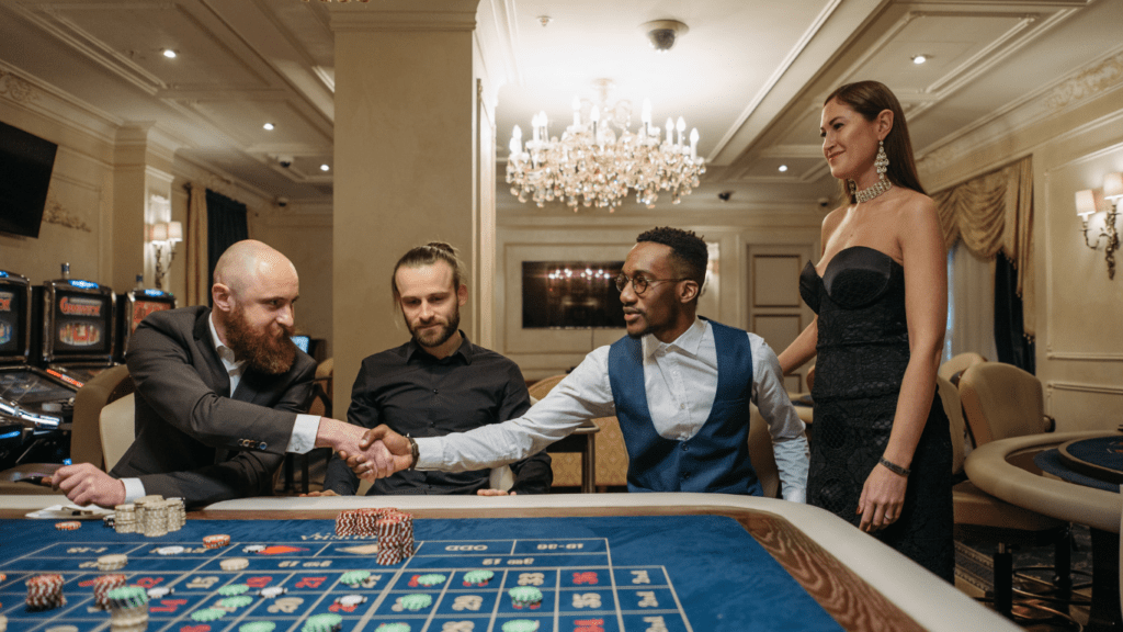 a group of people playing casino roulette