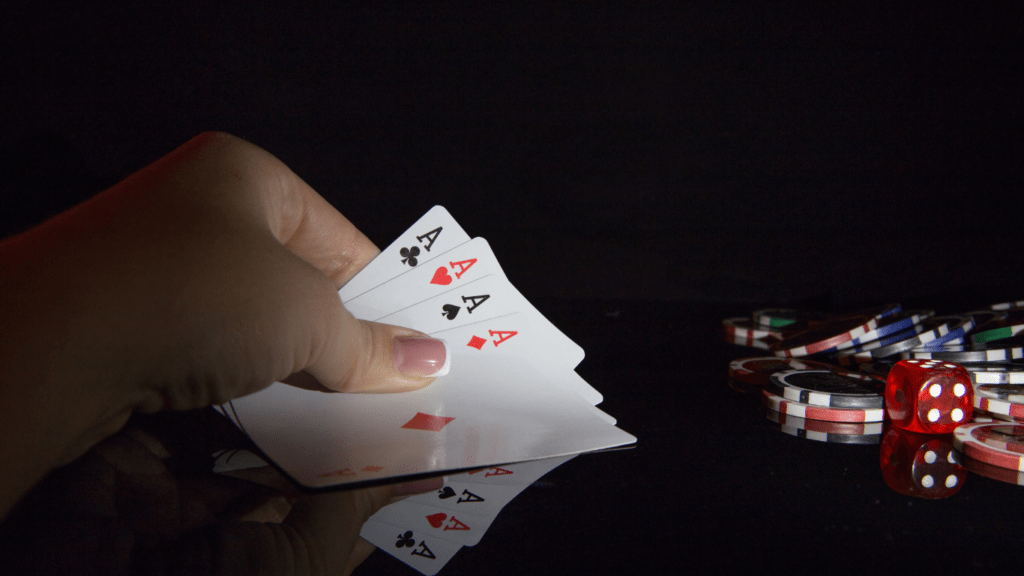 a person holding a casino card