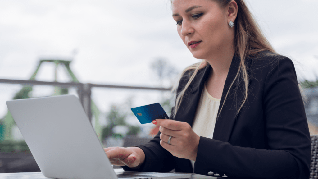 a person holding a credit card