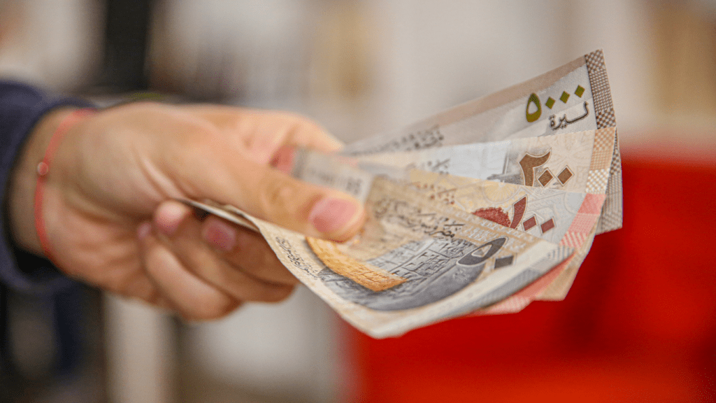 a person holding a local currency