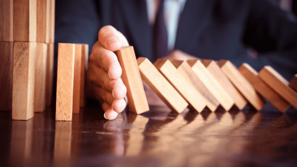 a person is placing wooden blocks on a table